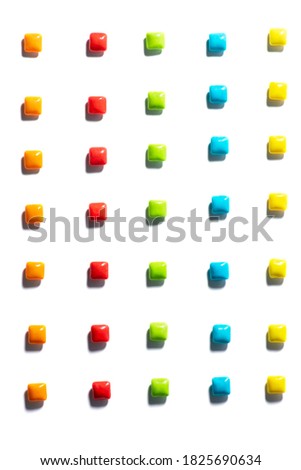 Candy in a row. Colorful candies , chewing gum are placed in a row with a contrasting shadow on a white isolated background