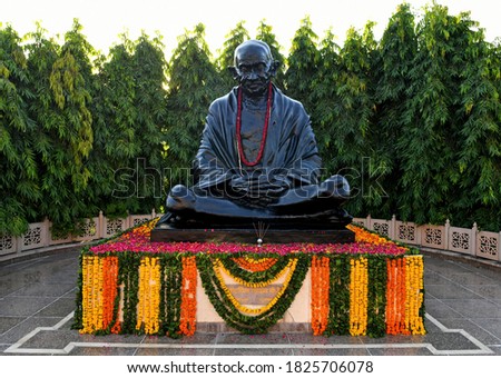 Black stone statue of the Father Of Nation Mahatma Gandhi at a park in Jaipur, Rajasthan. Royalty-Free Stock Photo #1825706078