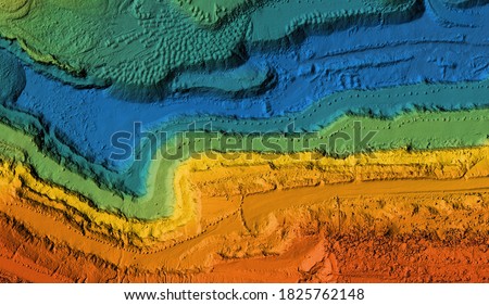 Model of a mine elevation. GIS product made after processing aerial pictures taken from a drone. It shows excavation site with steep rock walls Royalty-Free Stock Photo #1825762148