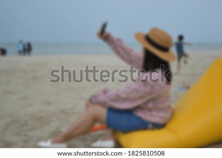 Blur the picture of a beachside woman