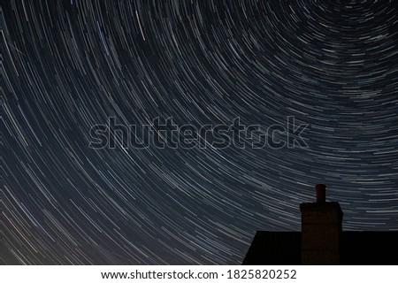 Northern hemisphere star trails with building chimney and following The Big Dipper constellation during the Covid-19 pandemic with little airplane activity remains. 29 May 2020