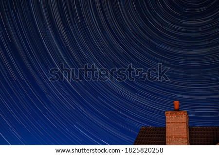 Northern hemisphere star trails with building chimney and following The Big Dipper constellation during the Covid-19 pandemic with little airplane activity remains. 29 May 2020