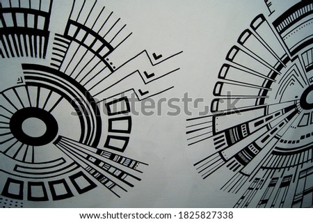 Mechanical abstract circles. Marker drawing on the wall. The idea for painting a wall in the interior. Simple graphic geometric patterns.