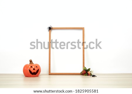 Wooden frame with jack o lantern Lovely on decoration a shelf or desk with white wall with. Halloween concept copy space for text
