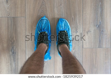 Shoe protection by adapted plastic bag system. Hygienic protection measure.