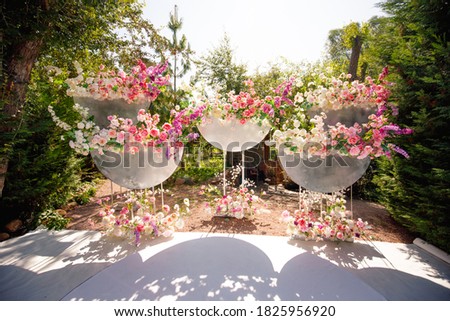 Decorative design of a wedding arch with flowers.