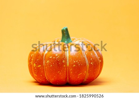 Halloween pumpkin with orange background
