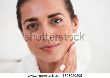 Beautiful caucasian woman touch face and enjoying ideal flawless fresh smooth facial skin. Close up portrait. Laser skin resurfacing, glycolic acid peel, anti-ageing skincare procedures and cosmetics Royalty-Free Stock Photo #1826020205