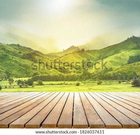 wooden table top with the mountain landscape natural background