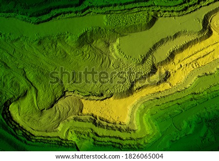 Model of a mine elevation. GIS product made after processing aerial pictures taken from a drone. It shows excavation site with steep rock walls Royalty-Free Stock Photo #1826065004