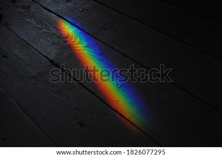 rainbow texture on a wooden surface. photo was taken in Minsk, Belarus