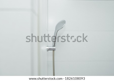 Shower in the bathroom. Concept of washing hands, using water in the bathroom. Water pouring from the tap.