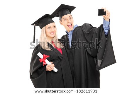 Male and female student taking a selfie with mobile phone isolated on white background