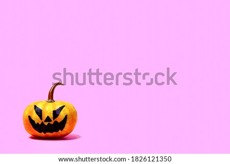 Pumpkin jack head on pink background. Halloween minimal concept.   