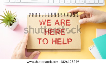 We are here to help, Text message on white paper Royalty-Free Stock Photo #1826123249