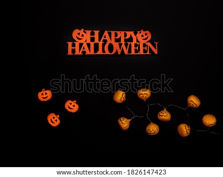Halloween background. Halloween decorations, spiders, bats, pumpkin, black background. Happy Halloween!