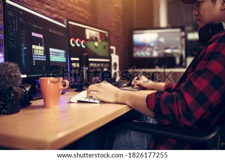 Blogger or vlogger working editing video footage job of the content creator Royalty-Free Stock Photo #1826177255