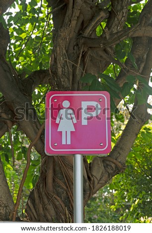 Sign for woman parking in car park. Lady parking sign.
