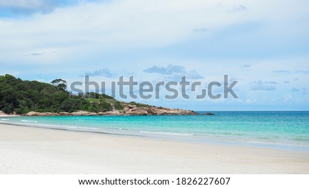Beautiful white beach with white sand and mountain with blue sky, soft breeze and sunshine. The best travel to relax on vacation day in summer. perfect panorama view of paradise beach.