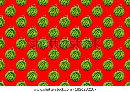 Watermelon pattern on red background. Minimal fruit concept.