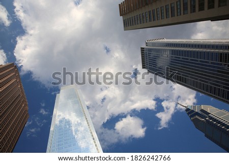 Bottom up view of Philadelphia skyscraper and reflection in glass in downtown Philadelphia  Pennsylvania, USA 