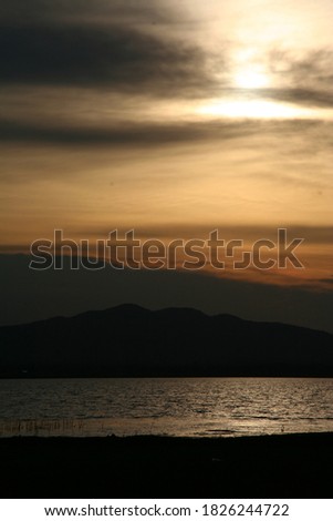 sunset over the lake in nation park, Beautiful rainforest landscape with fog in evening Thailand