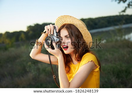 surprised woman looking into the camera lens nice shot nature