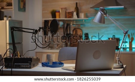 Professional setup for recording podcast in home studio of vlogger. Influencer recording social media content with production microphone. Digital web internet streaming station