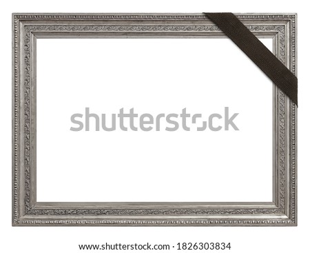Silver frame with black mourning ribbon for paintings, mirrors or photo isolated on white background