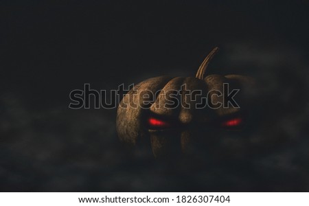 halloween pumpkin with evil red eyes, illustration of evil pumpkin in the dark at night with fog, dramatic horror scene, mystical and spooky photo 