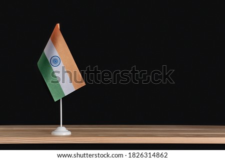 Flag pole. National table flag of India on black background. National symbol of Republic of India.