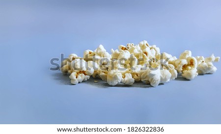 isolated popcorn  blue on blue background. 