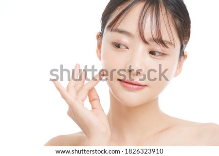 Beauty portrait of young Asian woman on white background Royalty-Free Stock Photo #1826323910