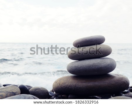 stack of zen stones on pebble beach.