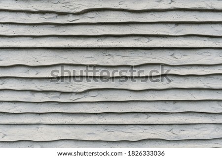 This is grey striped wall of building.