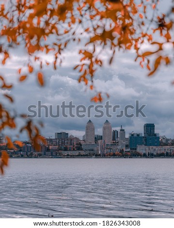 cloudy autumn day. cloudy day with a panoramic view of the city from the water. walks along the shore