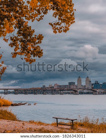 cloudy autumn day. cloudy day with a panoramic view of the city from the water. walks along the shore