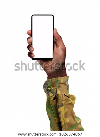 Hand of a man in military clothing a smart phone screen isolated on a white background