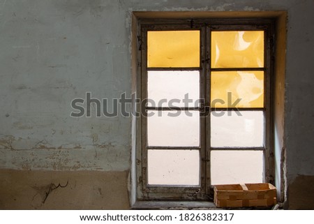 Old dirty interior with stained old window