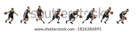Running on. Young basketball player of team training in action, motion in jump of step-to-step goal isolated on white background. Concept of sport, movement, energy and dynamic, healthy lifestyle. Royalty-Free Stock Photo #1826386895