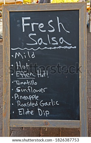A chalkboard sign advertises fresh salsa.