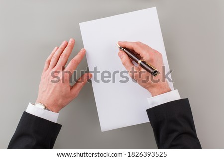 Hands of businessman signing the contract document. People, business, finance and enterprising concept.
