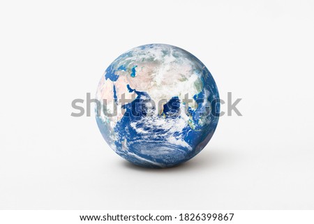 World environment day concept. Earth globe model with shadow on white background. Elements of this image furnished by NASA