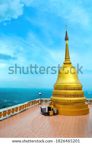 buddhist tiger cave temple (Wat Tham Sue) in Krabi, Thailand. Gold pagoda.Sea of clouds