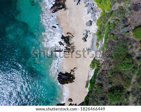 Aerial view of cliff and white sand beach of Tegal Wangi beach in bukit peninsula - Bali - Indonesia