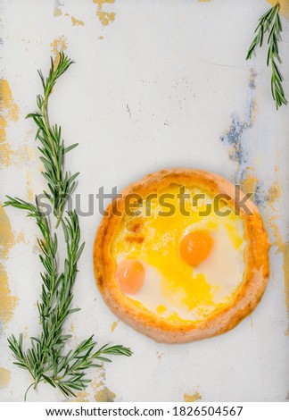 Pita (pita / pizza) with egg and butter. 