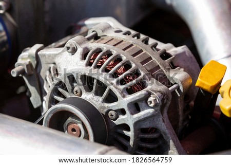 An alternator is an electrical generator that converts mechanical energy to electrical energy in the form of alternating current. Royalty-Free Stock Photo #1826564759