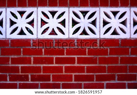 Red Brick Wall with Floral Concrete Blocks