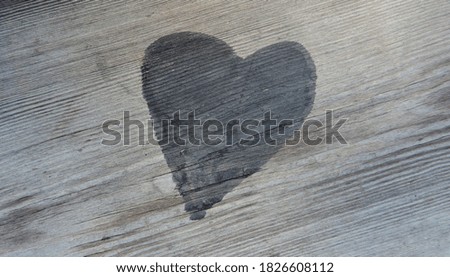      black heart on wooden boards     