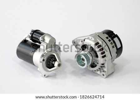 Spare parts, electrical equipment for the car. Repair and maintenance of electrical equipment. Car generator and car starter on a white background, close-up. Royalty-Free Stock Photo #1826624714